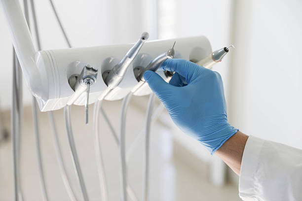 Professional Tooth Extraction technician working in Woodmore, MD